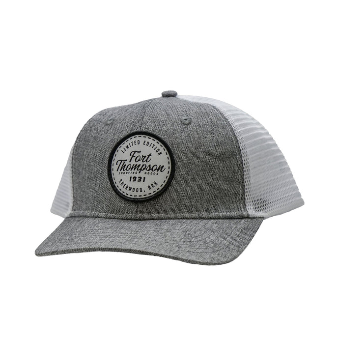 Front view of the Fort Thompson White Circle Patch Trucker Style Hat showing a white patch that says 